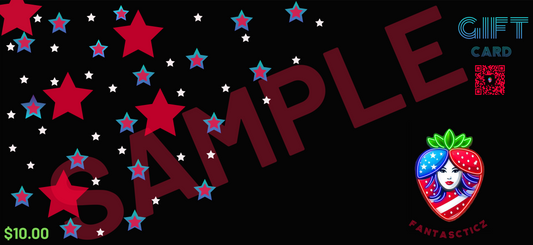A Fantascticz gift card design on a black background. A cascade of patriotic red, white, and blue stars is scattered from the top left corner. The bottom-right corner displays the Fantascticz strawberry logo. Above the logo, the words 'GIFT CARD' are written in a retro, stylized font, next to a decorative red QR code. The price of '$10.00' is shown in the bottom-left corner. A large, transparent red 'SAMPLE' watermark is overlaid across the center.